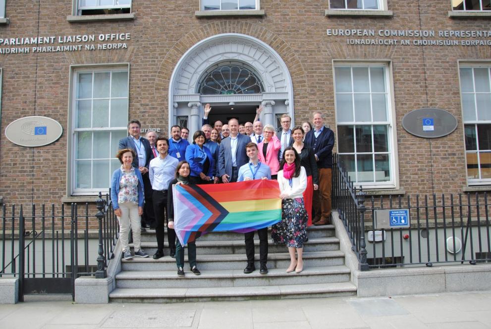 Staff of the EU Commission and European Parliament offices in Ireland behind the rainbow flag