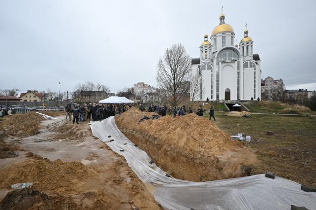 General view of the visit to a mass grave with Ursula von der Leyen, 7th, Eduard Heger, Slovak Prime Minister, 8th, Oleksii Reznikov, Ukrainian Minister for Defence, 9th and Anatoly Fedoruk, Mayor of Bucha